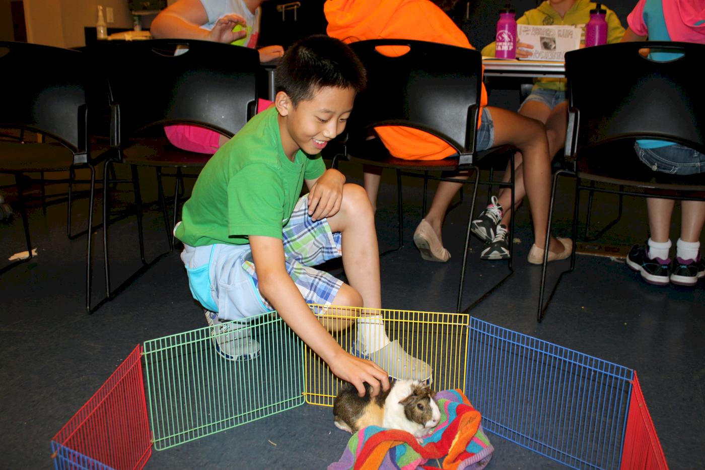 Campers explore genetics with Chubby the guinea pig